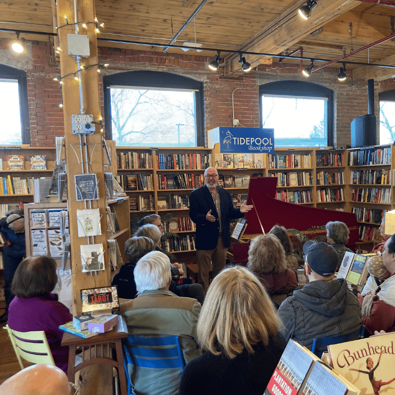 10 A group seated at a bookstore listening to a speaker