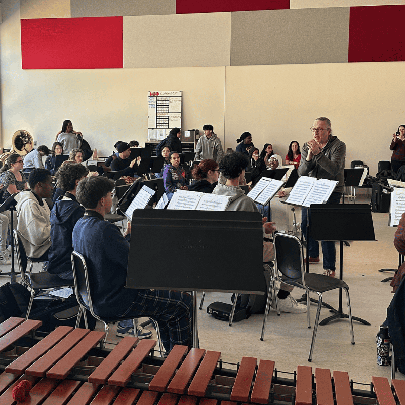 6 Student musicians in a group in a classroom